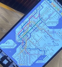 a cell phone with a subway map on it
